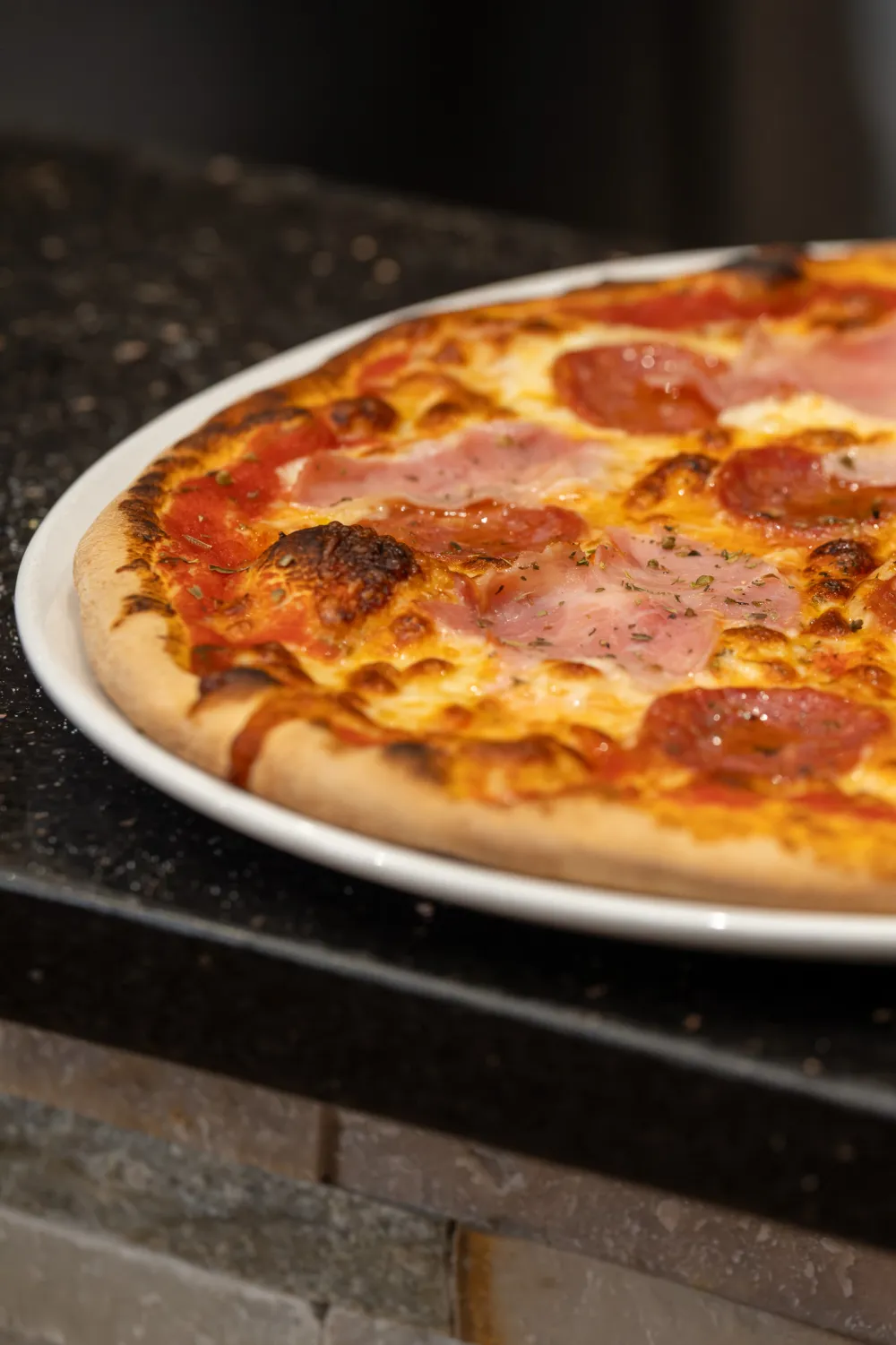 Pizza Americana with ham and pepperoni