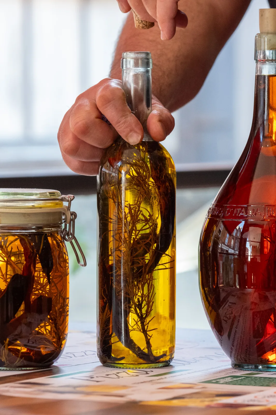 Herb-infused olive oils being prepared at Pizza Calzone